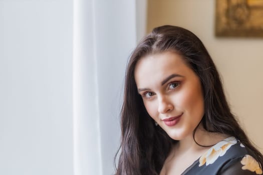 Portrait of attractive beautiful dark haired girl. Horizontally.