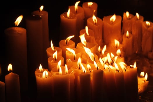 Lighting candles in chapel of Our Lady from the Kamenita vrata (Stone Gate) in Zagreb to remember and honor the deceased loved ones