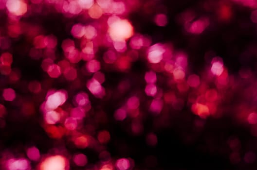 Abstract purple octagonal bokeh background with retro filter.Christmas lights blurred.