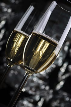 Two Champagne Glasses in front of the night lights