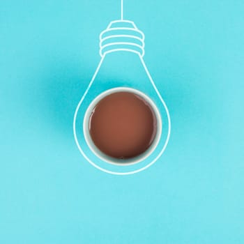Light bulb concept, having a new idea, brainstorming, start up business, creative marketing, education, cup of coffee in the middle