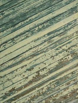 An old wooden diagonal plank wall brown and green aged