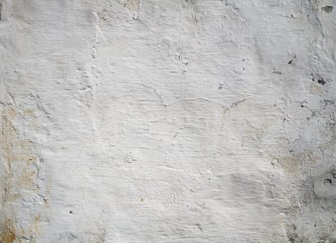An old peeling whitewash wall background aged