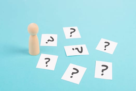 Man is thinking, question marks, brainstorming and looking for answers, solving a problem, making a decision, business and education concept