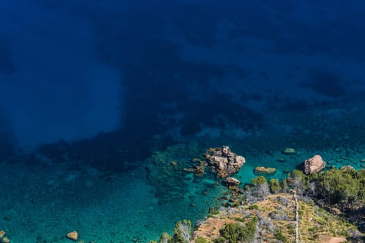 Sea waves and rocks on the steep west coast of Mallorca.