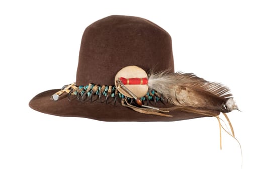 Old Native American hat with hat band made of raptor claws and turquoise on brown felt with eagle feather