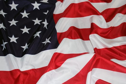 The flag of the United States, folded in waves. Flag Day. The concept of Independence Day, Memorial Day, elections..