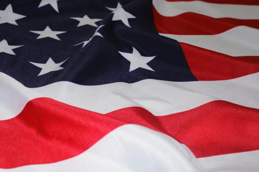 The flag of the United States, folded in waves. The concept of Independence Day, elections, Memorial Day. Flag Day..