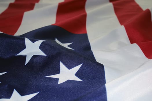 The flag of the United States, folded in waves. Flag Day. The concept of Independence Day, elections, Memorial Day..