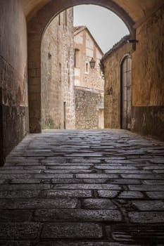 Marquis of Mirabel Palace passage of Plasencia. Medieval street at Old town, Caceres, Extremadura, Spain