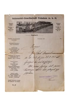 Potsdam, Germany - MAY 06, 2022. Close-up of an antique assessment letter from 1913 for a chauffeur. Clipping path. He worked for the company Automobil-Company Podsdam. Isolated.