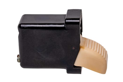 Old car parts. Close-up of an ivory-coloured fluted electric switch buttom with four connections for the car interior. Clipping path. GDR vehicle electrics around 1960 isolated.