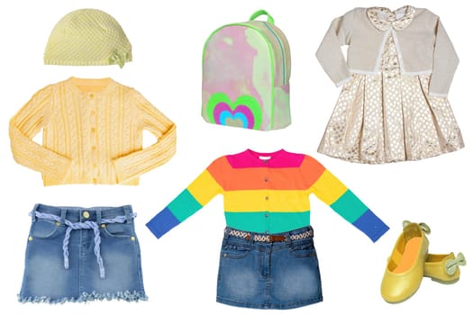 Collage set of little girl summer clothes isolated on a white background. The collection of jeans skirts, sweater, a blouse, dresses, a hood or cap, shoes and bag. Fashionable kids outfit.
