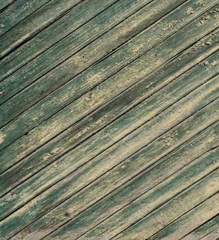 An old wooden diagonal plank wall brown and green aged
