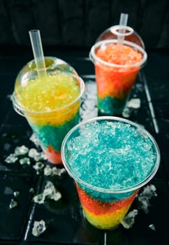 Slush drinks on a black surface