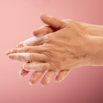 A part of washing perfect the hands. Concept of the hygienic rules of cleaning the hands with soap, foam and water.