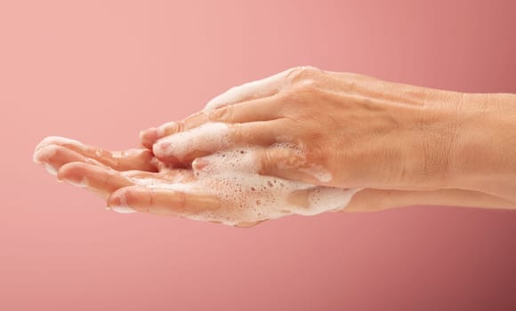 Young woman nurse cleaning her hands for medical disinfection body parts concepts.