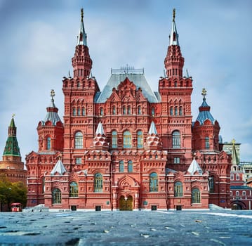 Facade of old museum of Russian history located on paved Red Square in Moscow
