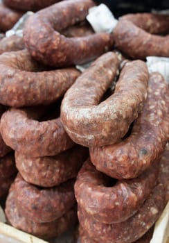 Iberian cured spicy sausage or salchichon. Displayed at street market stall