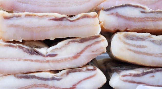 Iberian salt-cured pork fat. Pieces displayed at street market stall