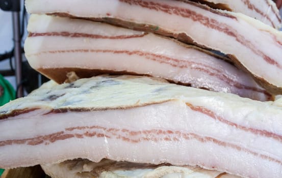 Iberian salt-cured pork fat. Pieces displayed at street market stall