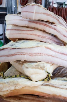 Iberian salt-cured pork fat. Pieces displayed at street market stall