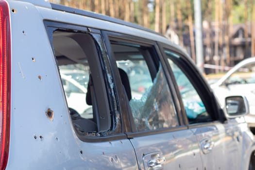 Car riddled with bullets. War of Russia against Ukraine. A car of civilians shot by the Russian military during the evacuation of women and children. Traces of bullets and fragments of shells