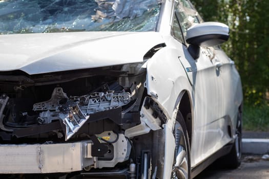 Traffic accident on the street, damaged car after a collision in the city. Accident due to speeding and alcohol intoxication. Transport background. The concept of road safety and insurance