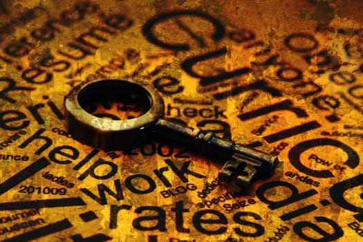 Close up of a Curriculum Vitae with old key