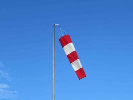 red and white wind indicator safety signal warning