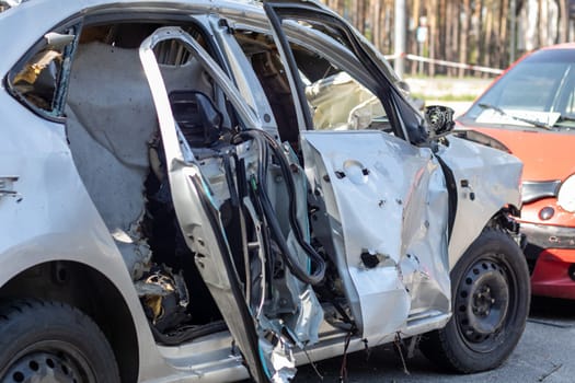 Traffic accident on the street, damaged car after a collision in the city. Accident due to speeding and alcohol intoxication. Transport background. The concept of road safety and insurance