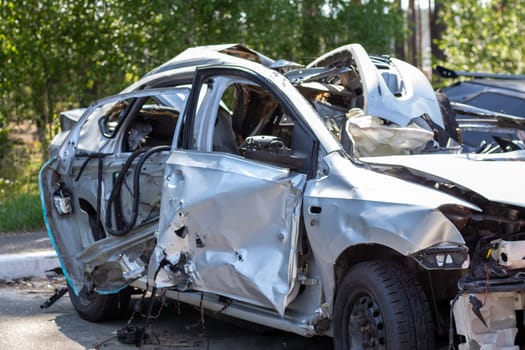 Traffic accident on the street, damaged car after a collision in the city. Accident due to speeding and alcohol intoxication. Transport background. The concept of road safety and insurance