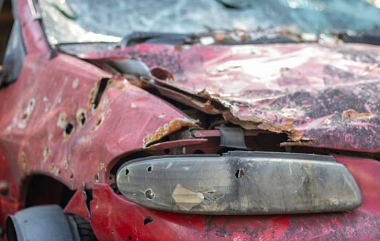 Car riddled with bullets. War of Russia against Ukraine. A car of civilians shot by the Russian military during the evacuation of women and children. Traces of bullets and fragments of shells