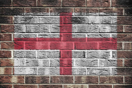 An England flag on a brick wall background