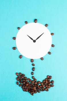 Alarm clock flower made from coffee beans, wake up in the morning, having a deadline, time for a break, minimalistic concept, blue background