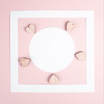 Pastel colored greeting card, white circle with copy space for text and hearts, valentines day, mothers day background, romantic layout, love concept