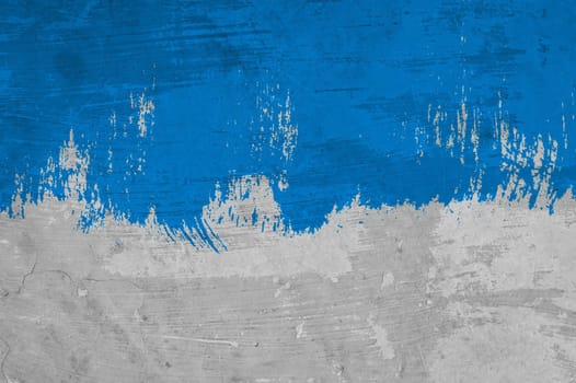 Grey concrete wall with painted blue color