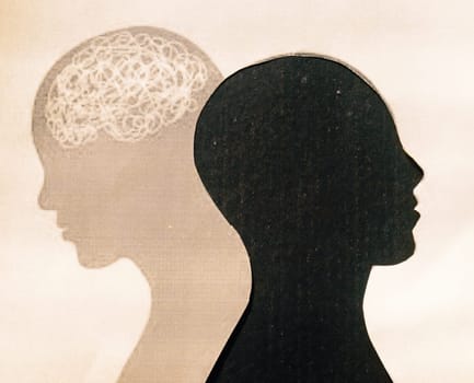 Human Brain Isolated Within Human Head and its shadow. Paper Abstract Illustration. Feelings of isolation and Mental Health concepts.