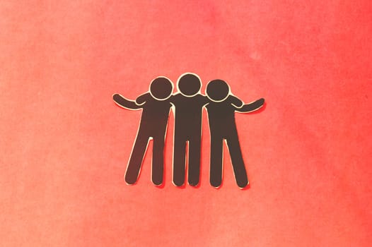 Paper cut happy friends with hand on shoulder in color background. Concept of friendship, help, support, love and togetherness.