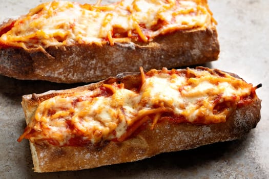 close up of rustic spaghetti in tomato sauce sandwich