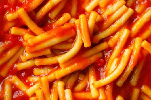 close up of spaghetti noodle in tomato sauce food background