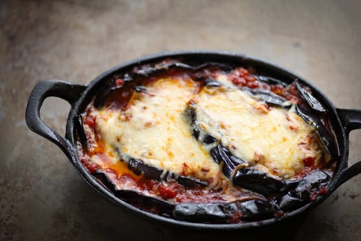 close up of rustic italian comfort food eggplant parmigiana