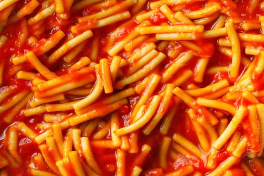 close up of spaghetti noodle in tomato sauce food background