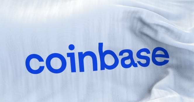 New York, USA, June 2022: White flag with Coinbase logo waving. Coinbase is an American company that operates a cryptocurrency exchange platform