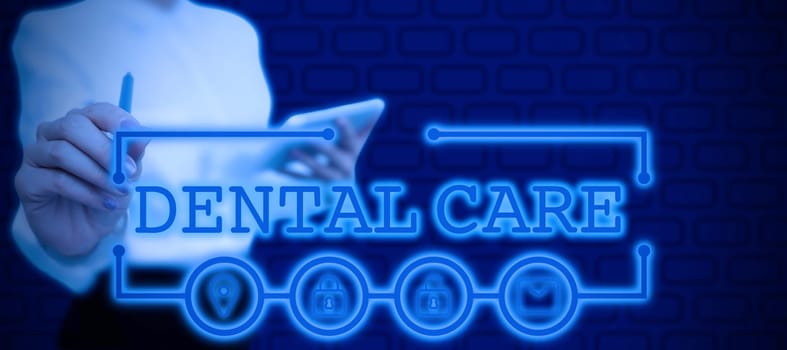 Sign displaying Dental Care, Word Written on maintenance of healthy teeth or to keep it clean for future Lady in suit holding pen symbolizing successful teamwork accomplishments.