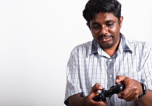 Asian happy portrait young black man funny use hand playing video game pad joystick controller, studio shot isolated on white background
