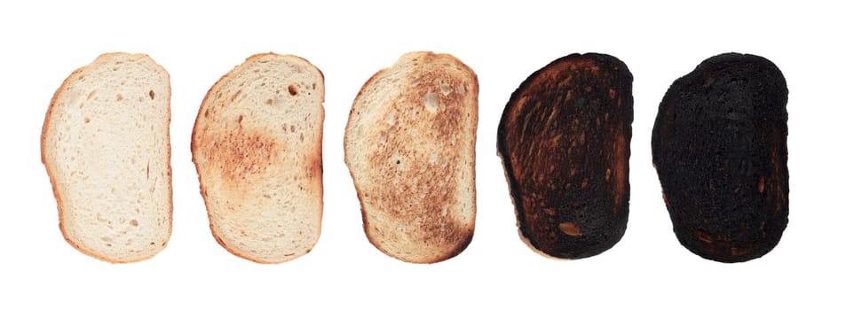 top view of slices of bread at different stages of toasting with last one completely charred and burnt isolated on white background