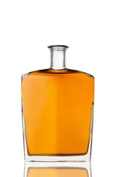 front view closeup of square modern shape cognac brandy bottle with no label isolated on white background with reflection