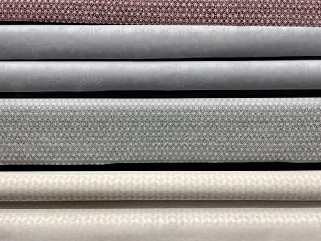 front view closeup of upholstery tapestry selection on rolls in shop