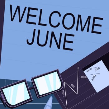 Conceptual caption Welcome June, Business approach Calendar Sixth Month Second Quarter Thirty days Greetings Paper sitting on desk consisting charts calculation financial plans.